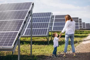 sb saules elektrines naujiena blog 1 mom with kid walking near solar panels